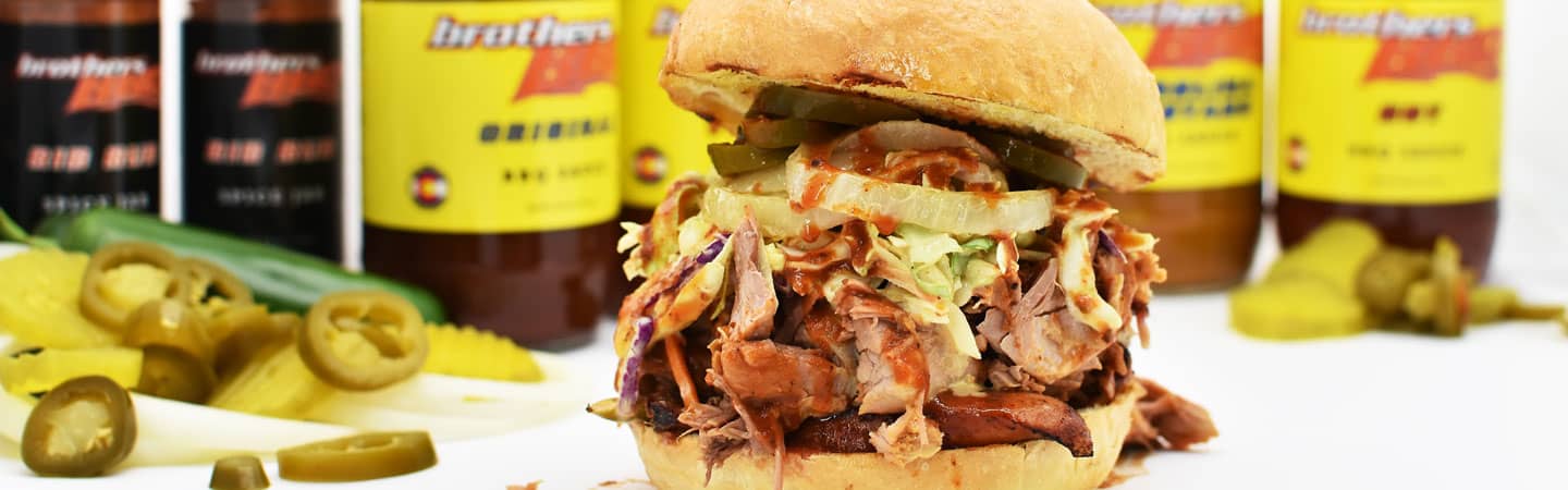 close up of bbq sandwich with coleslaw and onions from Brothers BBQ Colorado