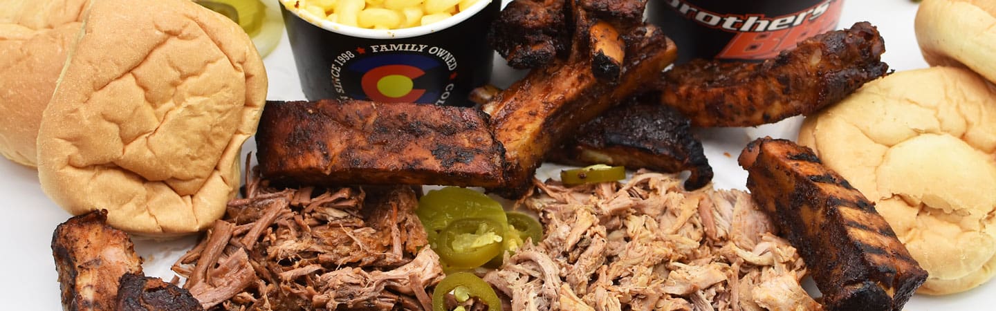 display of bbq meats, tofu, bread and sides Brothers BBQ Colorado