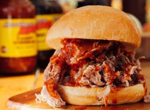 bbq pulled pork sandwich with sauce Brothers BBQ Colorado